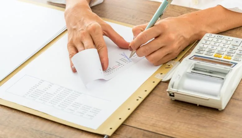 person calculating costs