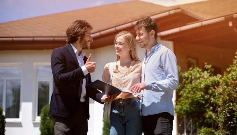 real estate agent talking to home buyers
