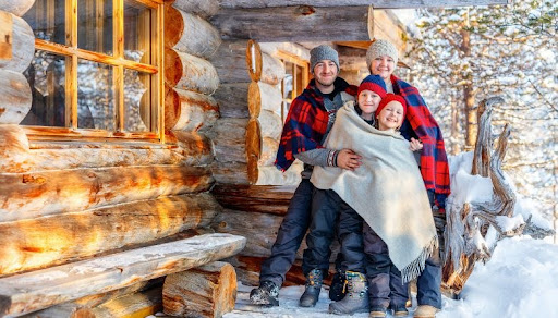 Idaho Winter Vacation Rentals: Extended Stays and Travel Tips 2 family in blankets in snow 1